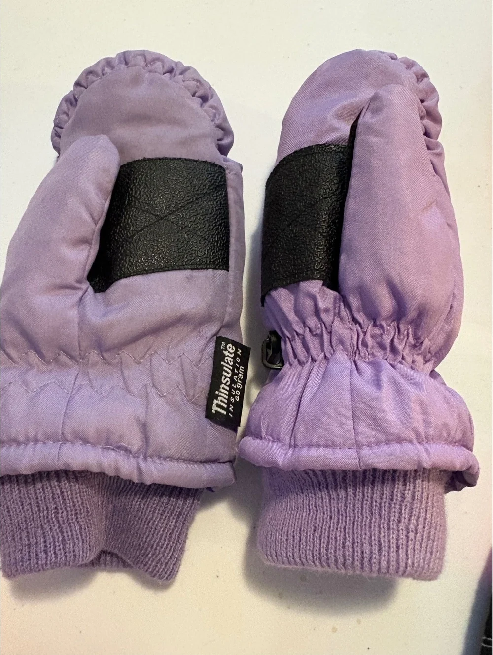 Three pairs of kids mittens